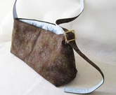 charmed Liebling trapezoidal shoulder bag in brown and blue