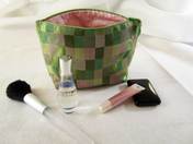 charmed Liebling small cosmetics bag in green and pink