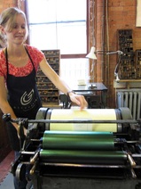 Anna working the printing press